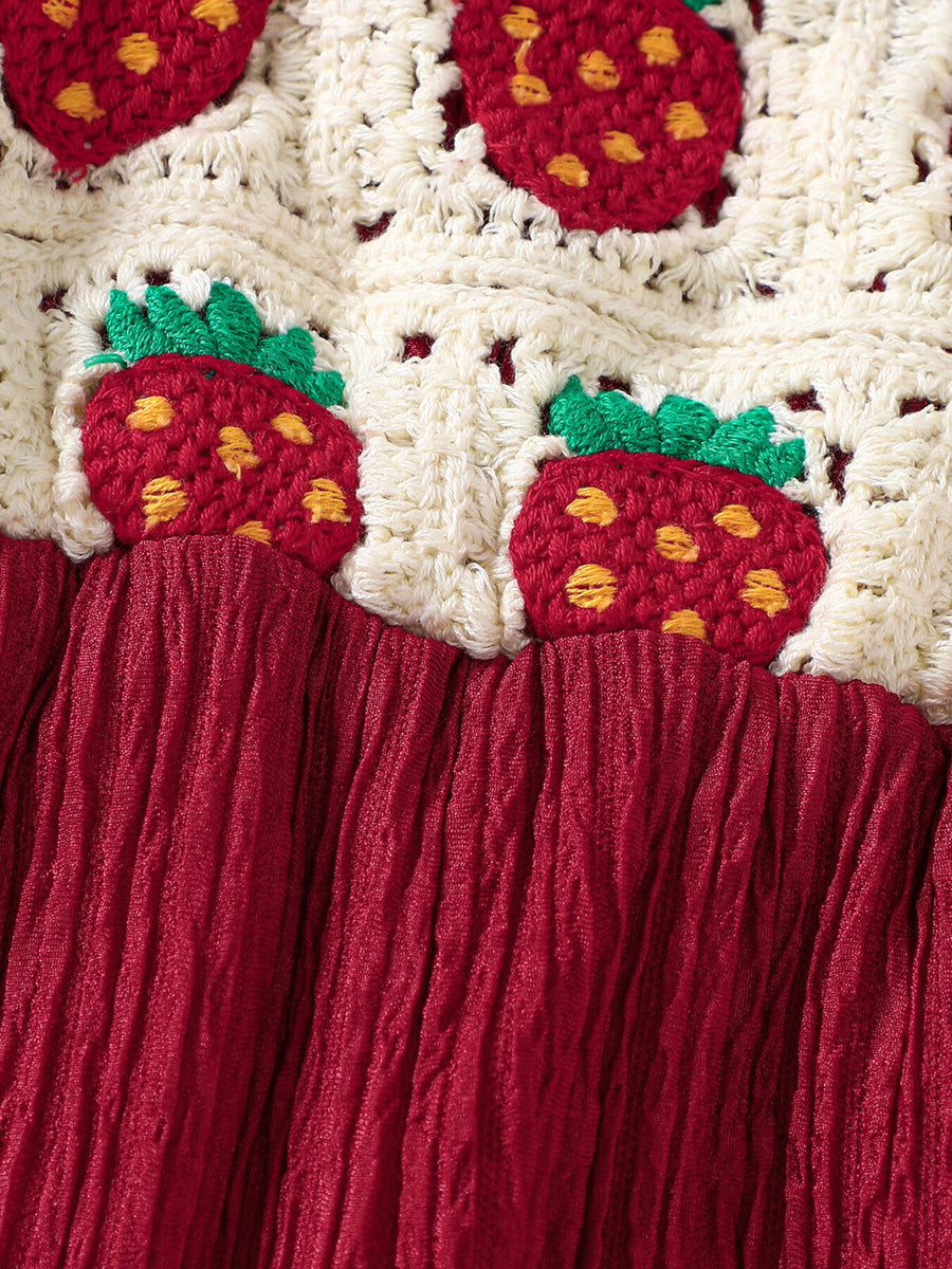 Crochet ruffle trim baby jumpsuit in cream with strawberry pattern and burgundy crinkle fabric bottom.