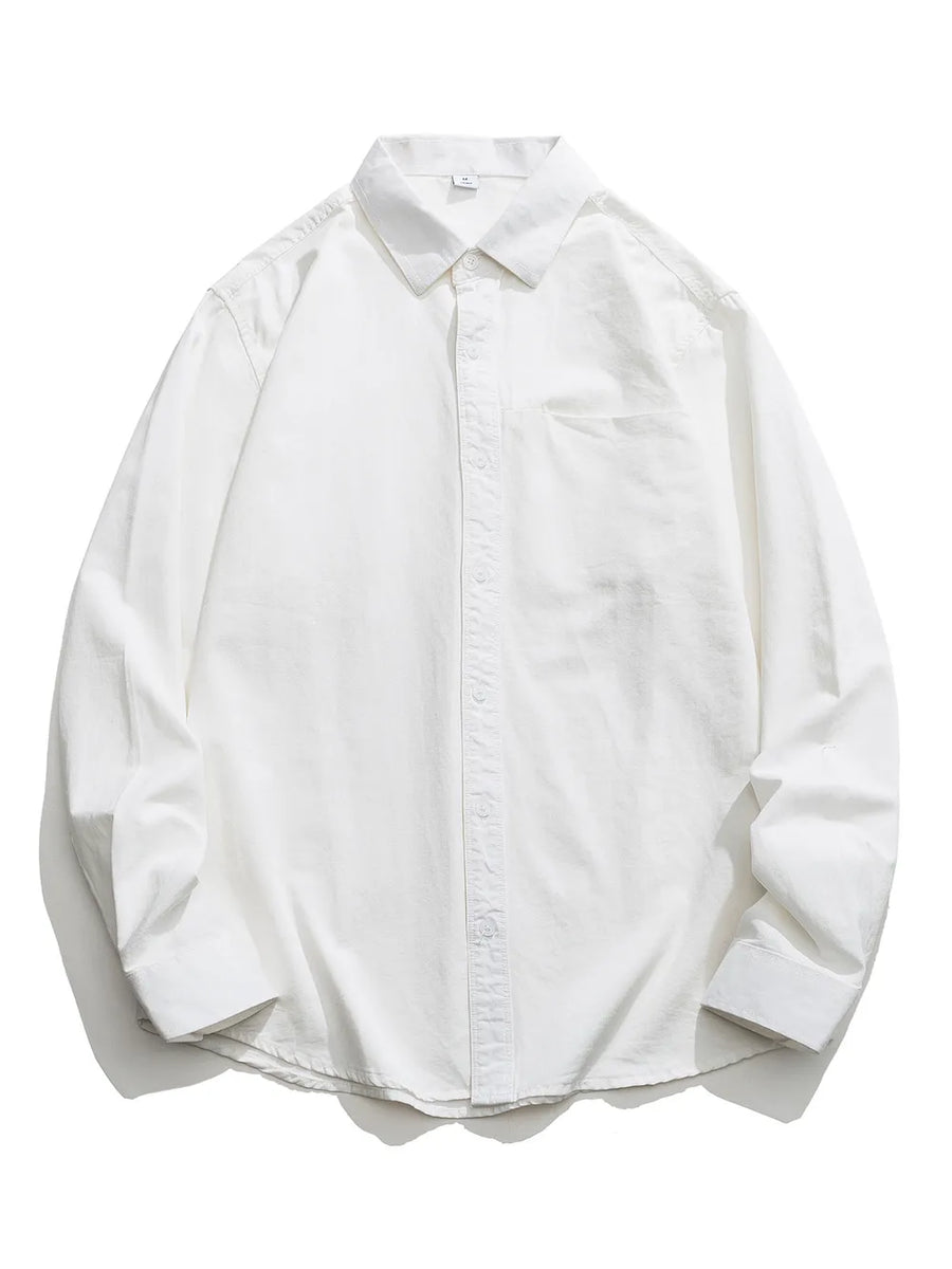White cotton button-down shirt with long sleeves and a chest pocket.