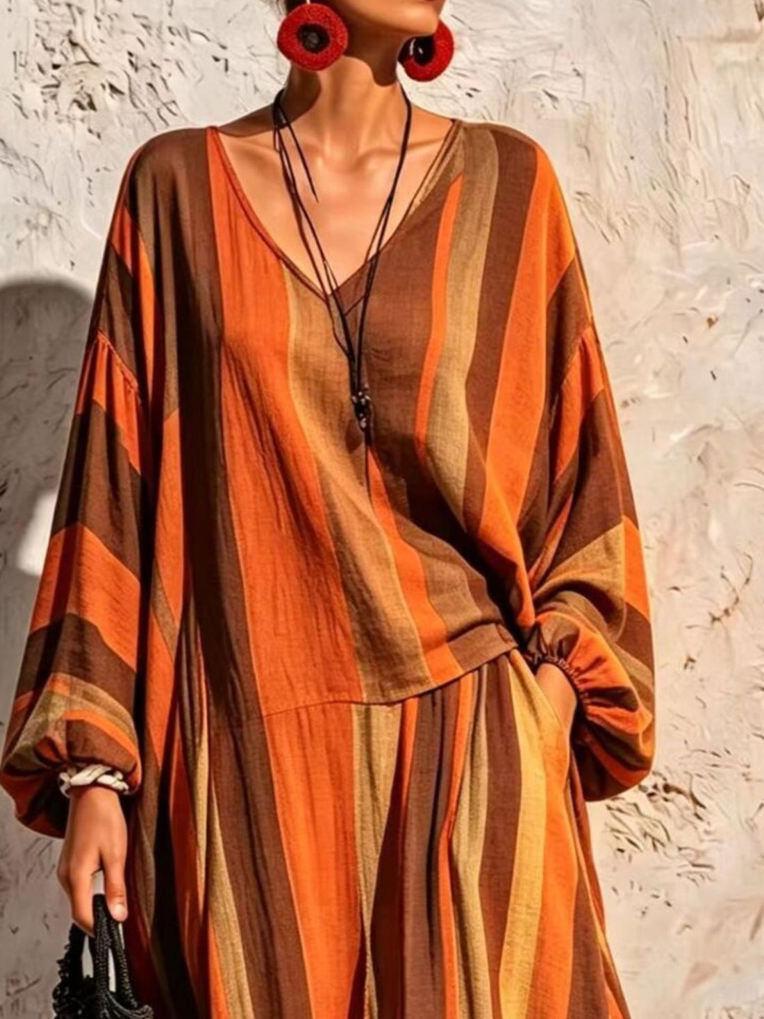 two-piece set featuring striped in Orange with 100% polyester Care instructions: Machine wash cold texture