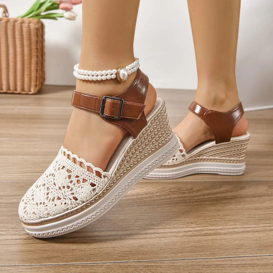 Beige crochet and leather wedge ankle strap sandals with a pearl ankle bracelet.
