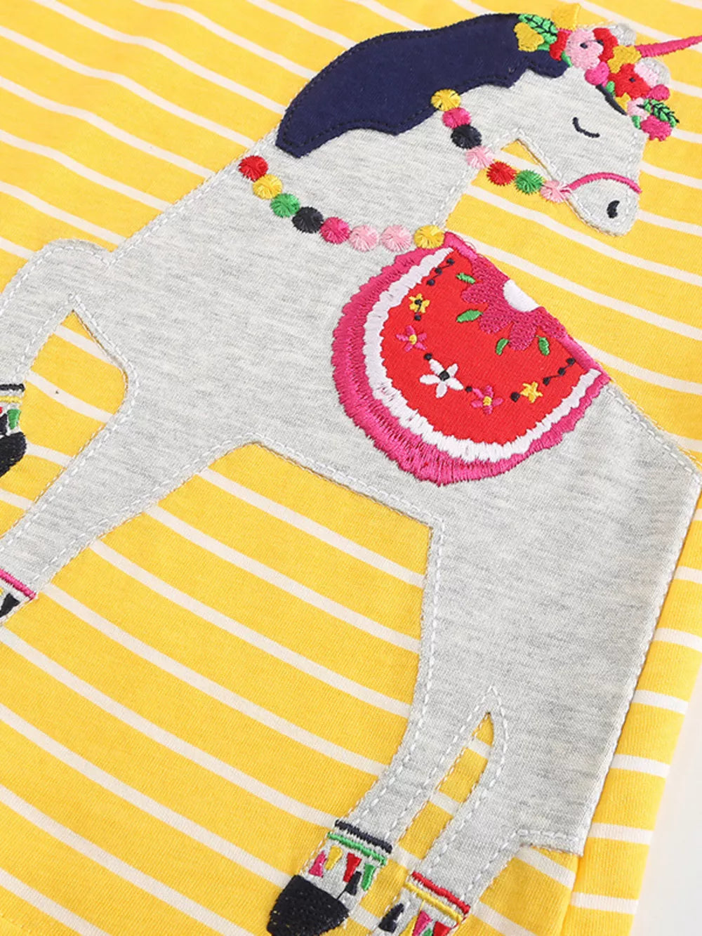 Yellow striped cotton blend toddler dress with a whimsical unicorn applique and colorful details.