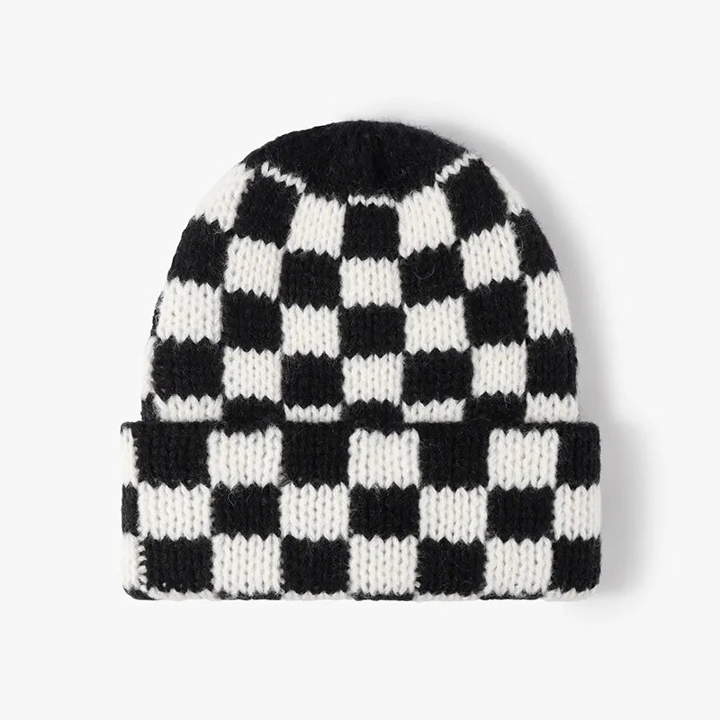 Checkerboard knit beanie in black and white with a cuffed brim.