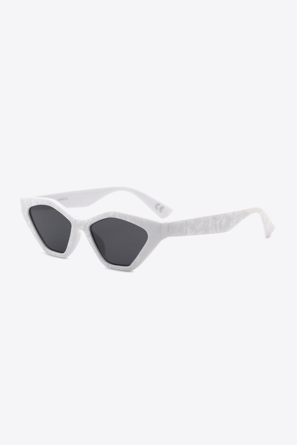 Geometric cat-eye sunglasses in white with a subtle textured pattern and dark lenses.