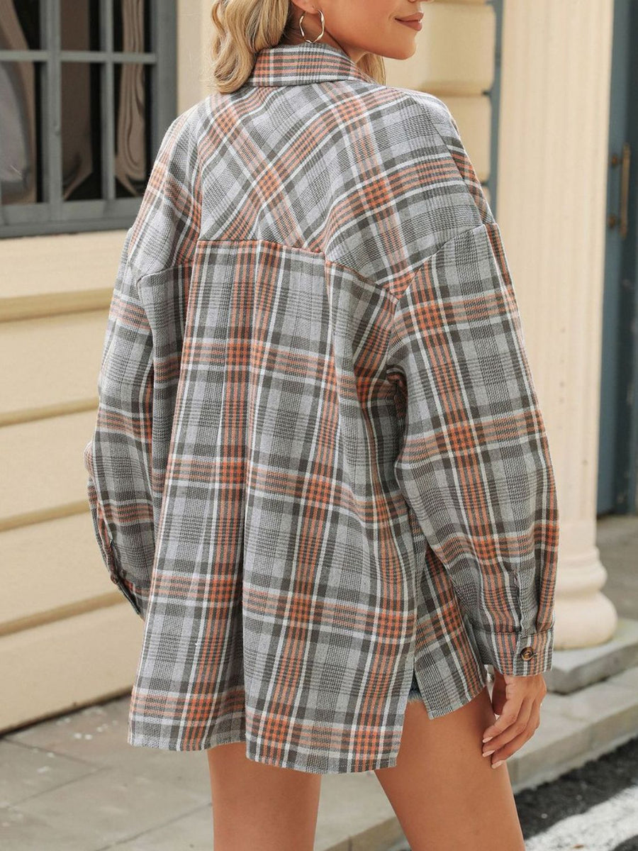 Gray plaid collared long sleeve shirt with button cuffs and a back yoke detail.