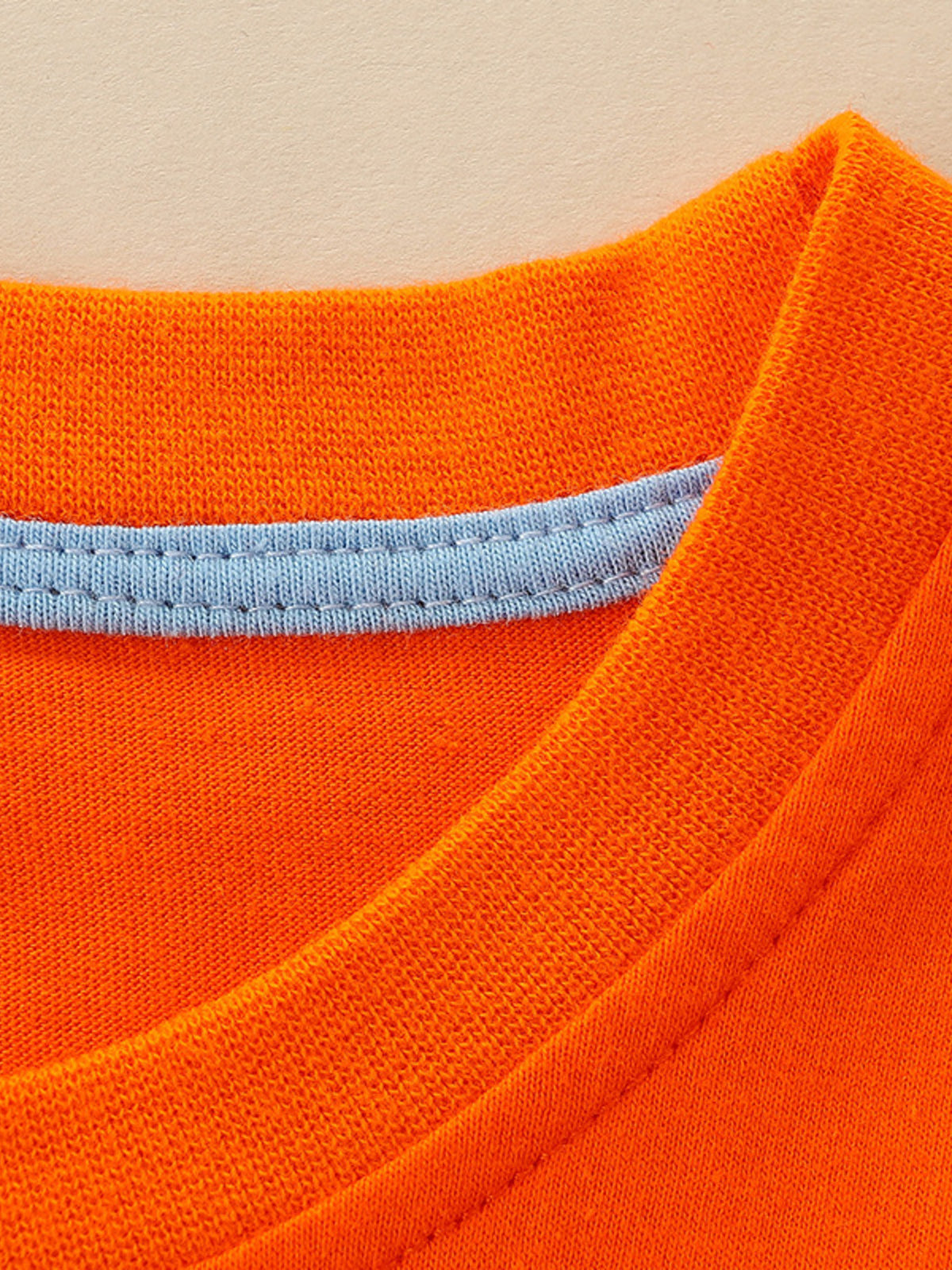 Orange cotton crew-neck t-shirt with light blue trim detail