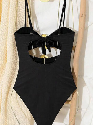 Black one-piece swimsuit with cutout back detail and bow accent