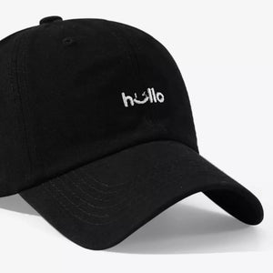 Black cotton baseball cap with white embroidered "hello" detail