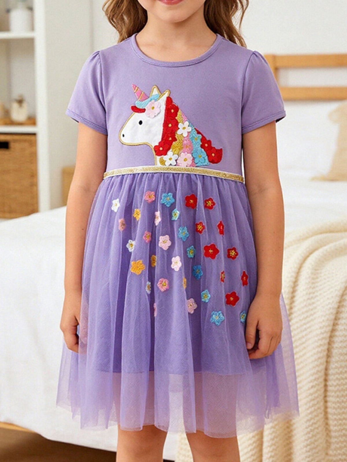 Purple toddler tulle dress with unicorn appliqué and floral accents.