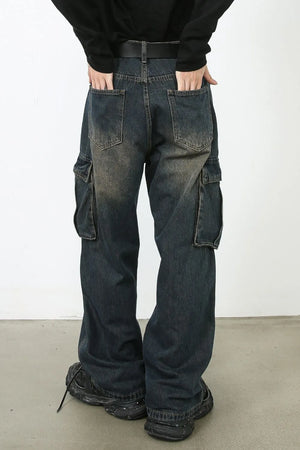 Faded wash dark wide-leg cargo jeans with multiple pockets.