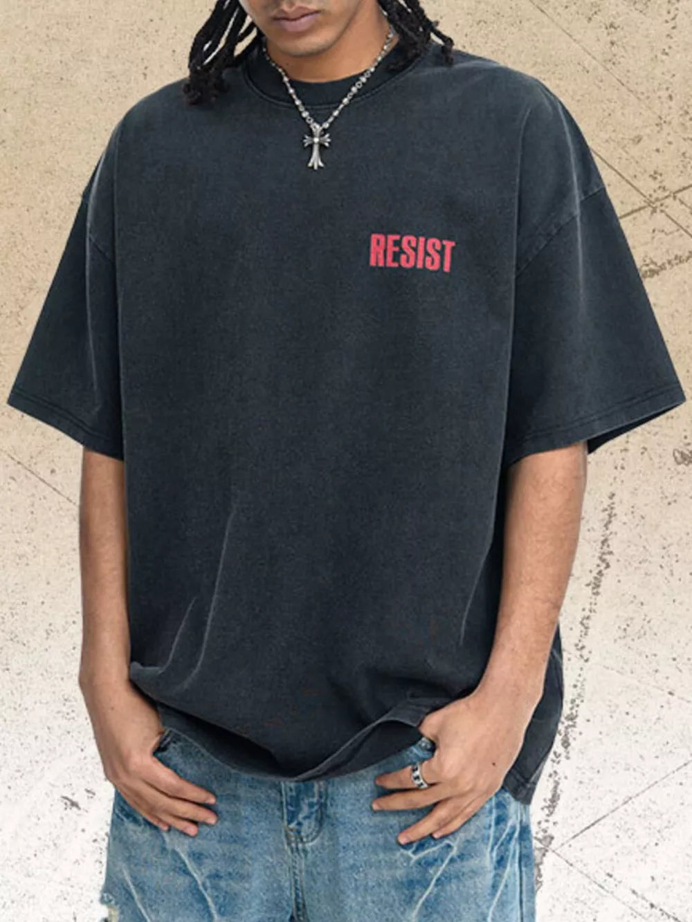 Distressed charcoal graphic tee with red "RESIST" text, short sleeves, crew neck.