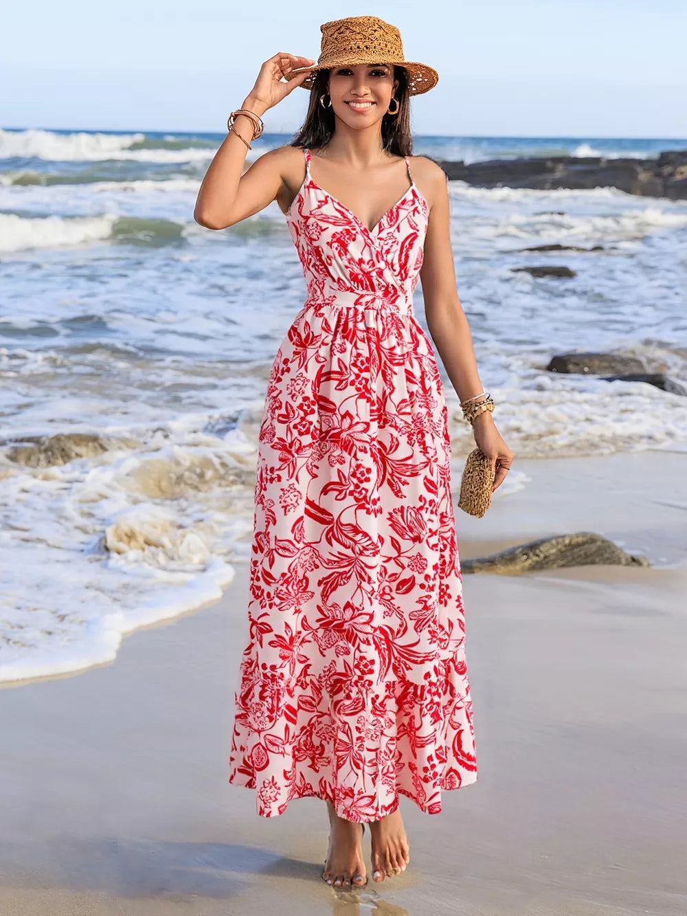 Floral faux-wrap midi dress with red print, spaghetti straps, defined waist, and tiered hem.