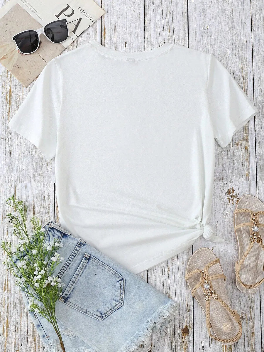 White t-shirt with short sleeves and a crew neck, tied at the waist.