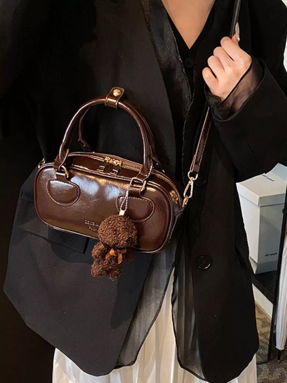 Chic mini crossbody bag in chocolate PU leather with teddy bear charm and top handle