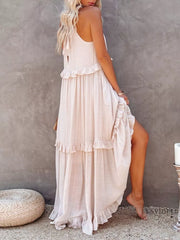 Apricot ruffled maxi dress with tie straps and tiered skirt.