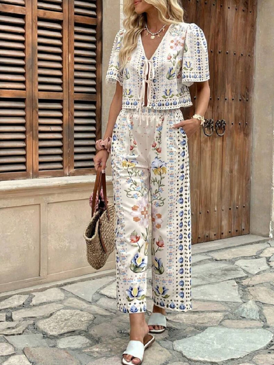 Floral tie-front cropped top and wide-leg pants set with short sleeves and a v-neck.