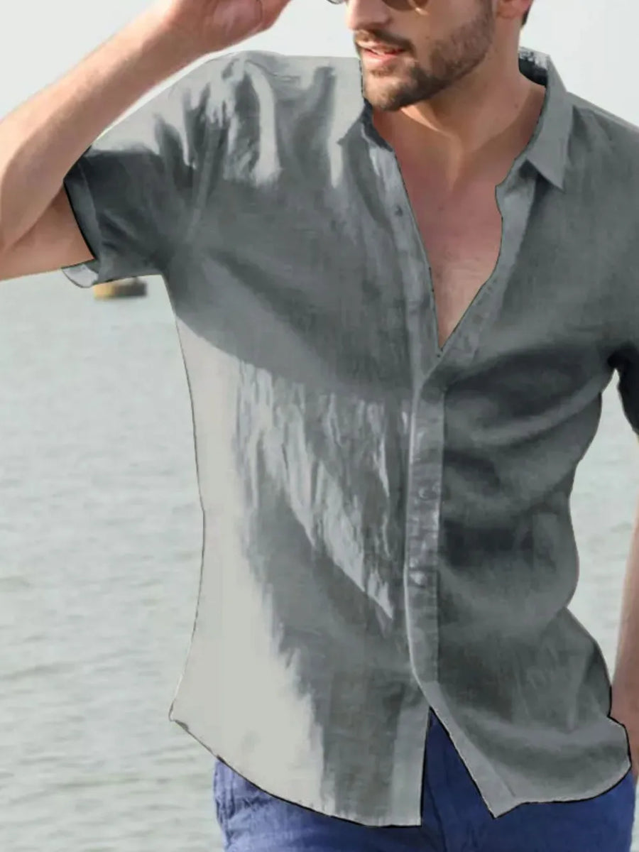 Gray linen resort shirt, relaxed fit, short sleeves, open collar, button-up front.