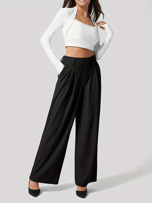 Black pleated wide-leg tailored trousers with a high waist and pockets.