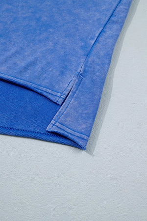 Blue cotton t-shirt with side slits and acid wash detail