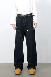 Dark wash carpenter jeans with wide, relaxed fit and contrast stitching.