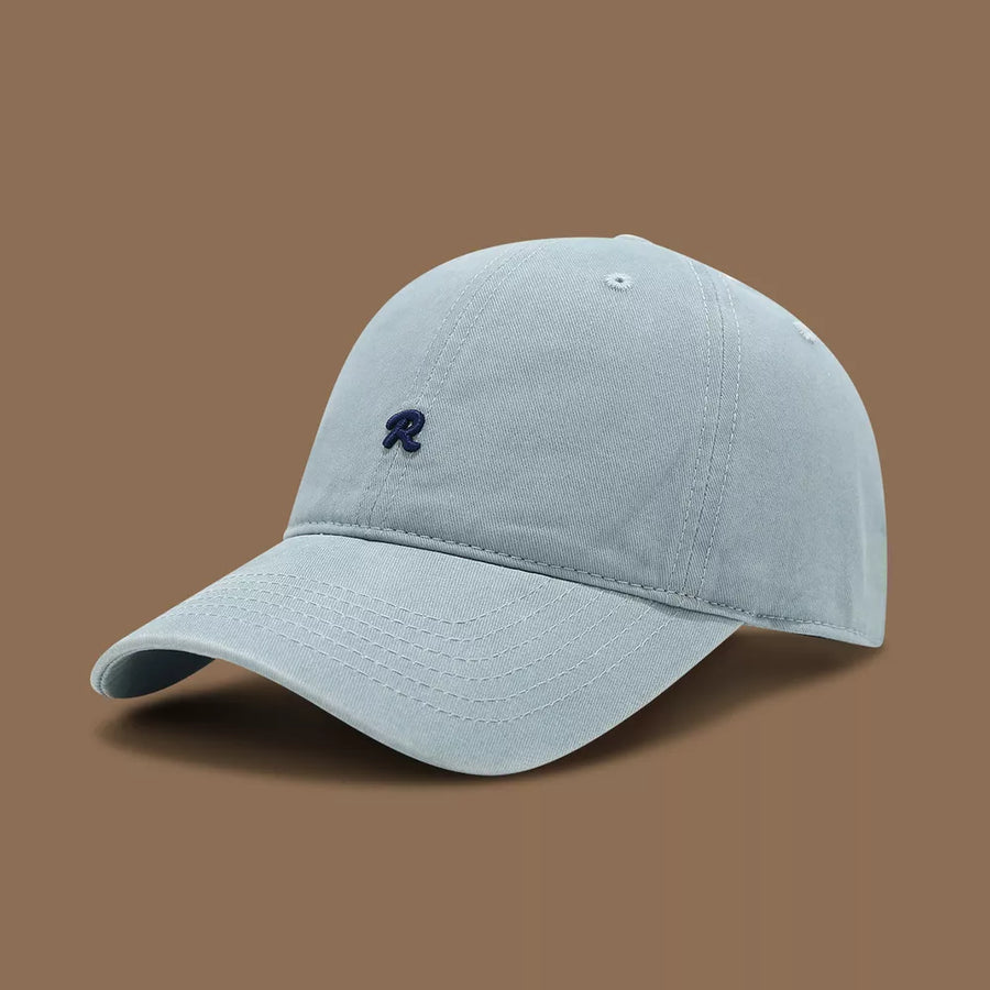 Light blue baseball cap with embroidered navy R logo and curved brim.