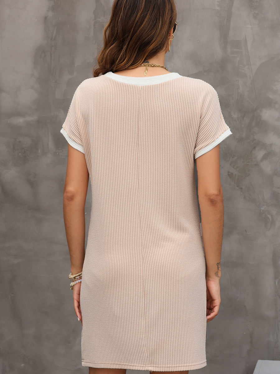 Beige t-shirt dress with crew neck, short sleeves, and above-knee length.