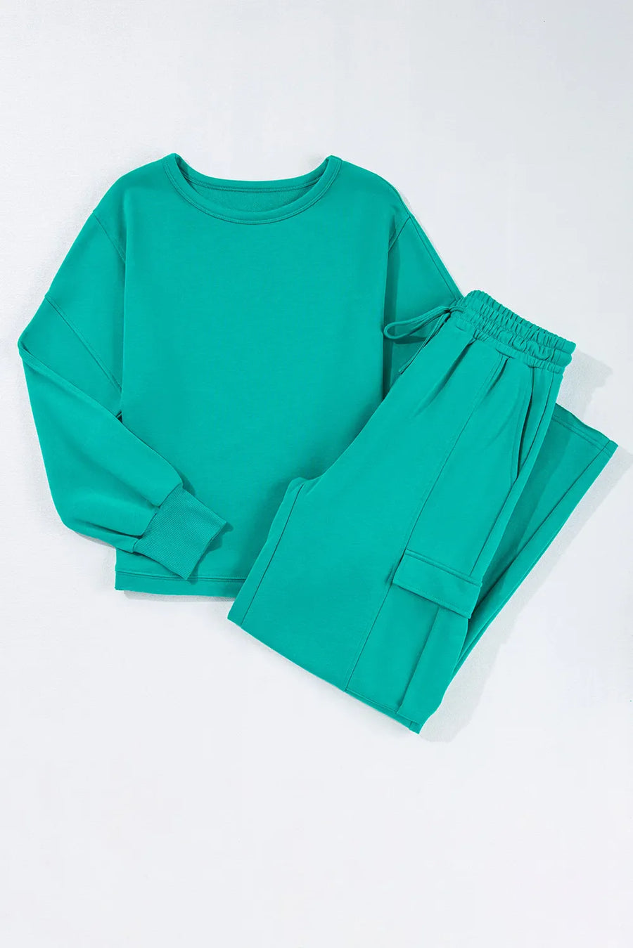 Turquoise relaxed fit lounge set with crewneck sweatshirt and cargo pocket pants.