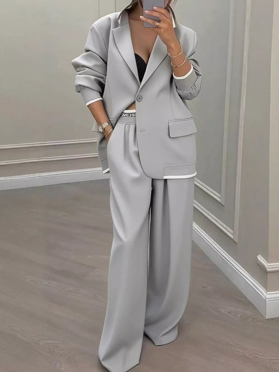 suit set in light gray featuring buttoned and relaxed fit