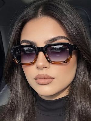 PC Frame material: Polycarbonate Lens material: Polycarbonate Temple material: P sunglasses in brown with boxy silhouette