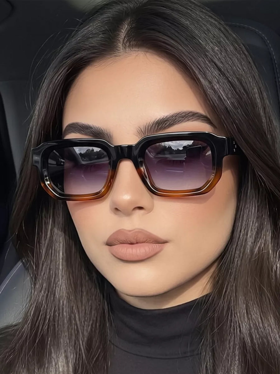PC Frame material: Polycarbonate Lens material: Polycarbonate Temple material: P sunglasses in brown with boxy silhouette