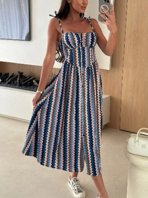 Midi dress with tie straps and zigzag stripe pattern in blue, brown, and pink.