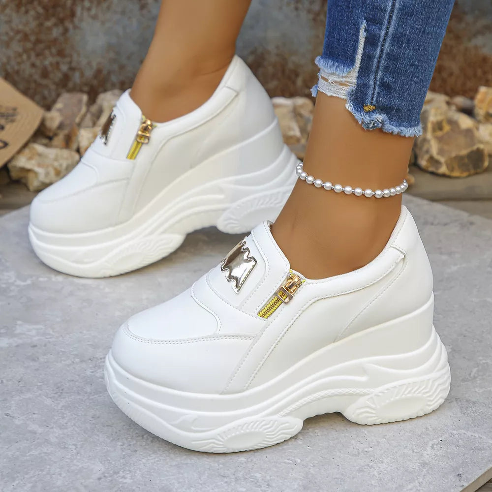 White round toe platform sneakers with side zipper and gold detail.