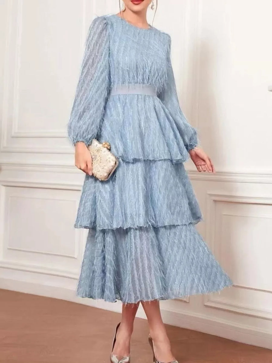 Sky blue tiered midi dress with balloon sleeves and a defined waist.