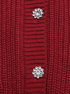 Red acrylic knit cardigan with pearl and rhinestone flower embellishments.