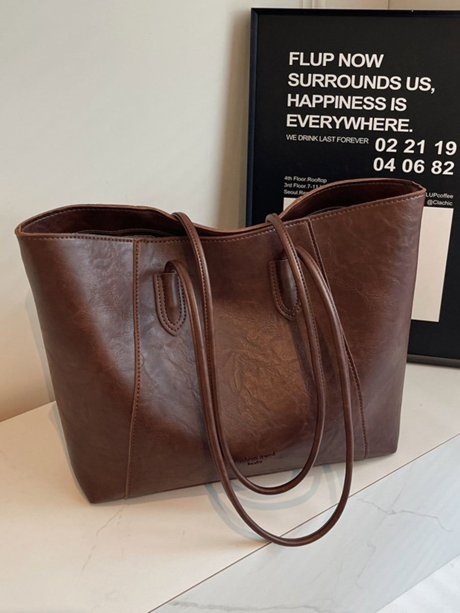 Premium crinkled pu leather tote bag in coffee brown with dual shoulder straps.