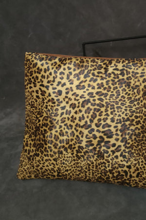Leopard print zip-top clutch bag with brown zipper detail