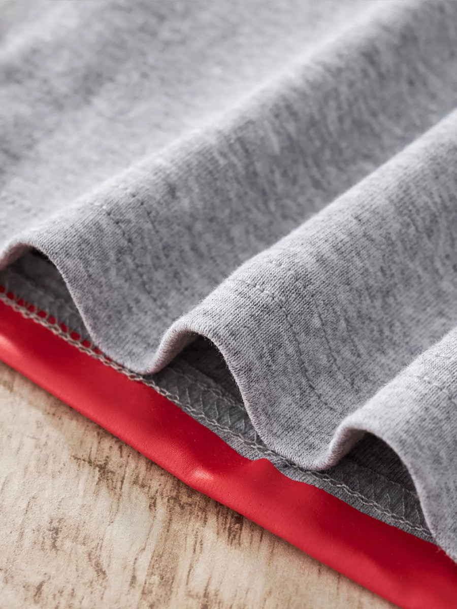 Light Gray cotton pajama set detail showing red trim and stitching.