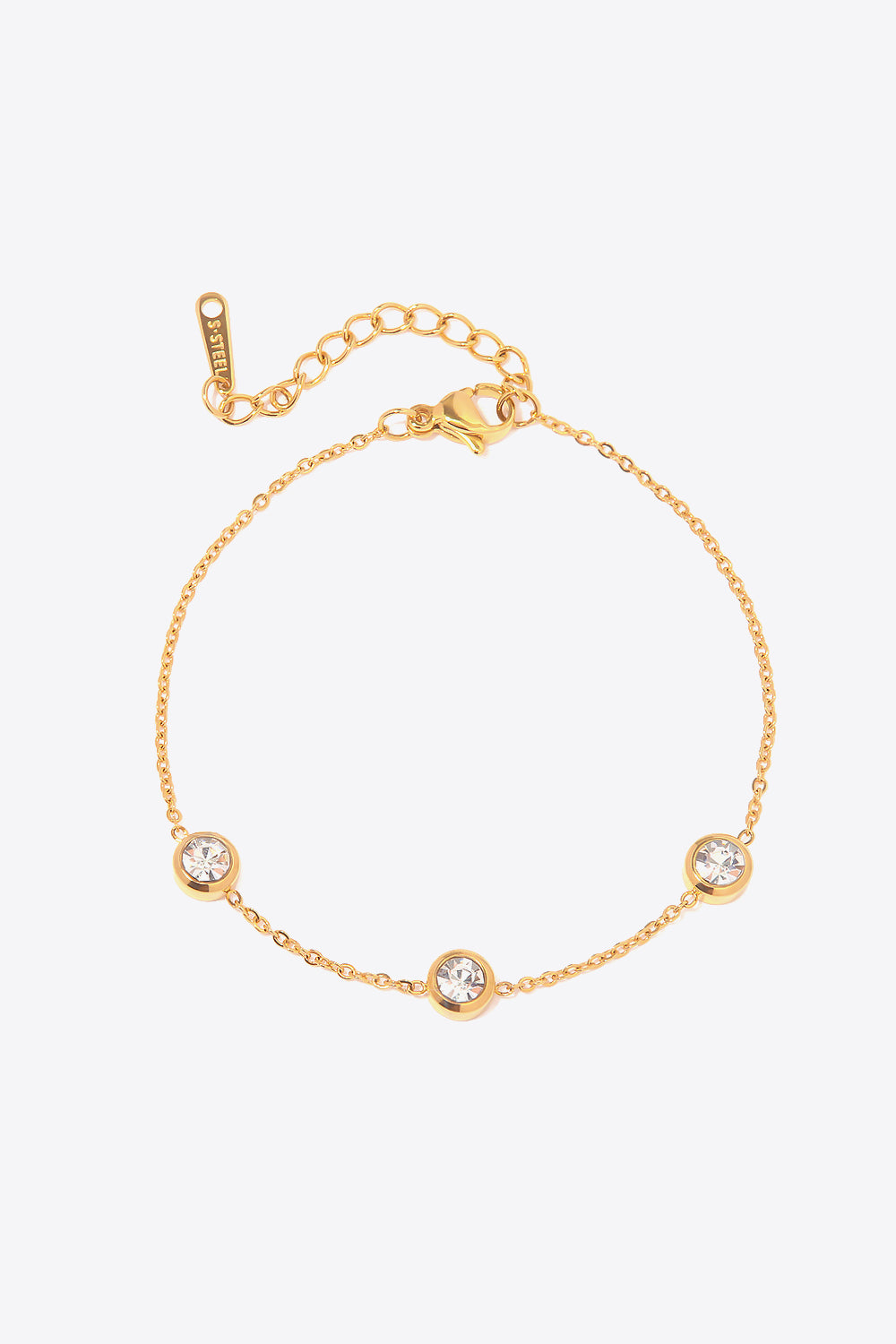 Gold chain bracelet with three round clear cubic zirconia stones