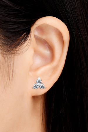 Trilogy moissanite stud earrings in gold with three round stones.