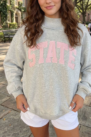 light pink sweatshirt featuring oversized and graphic-print