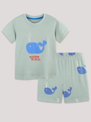 Toddler boys' light green cotton whale embroidered tee and shorts set with "Ocean Vibes" text.