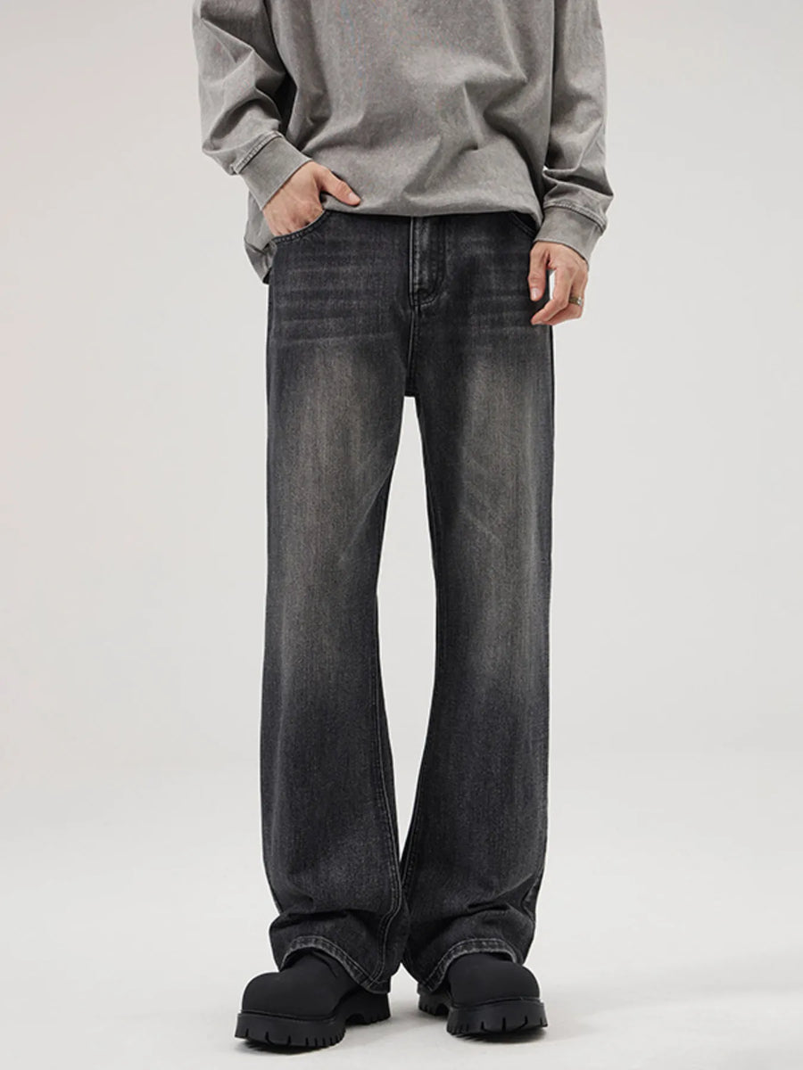 Men's black wide-leg vintage wash denim jeans with a comfortable fit.