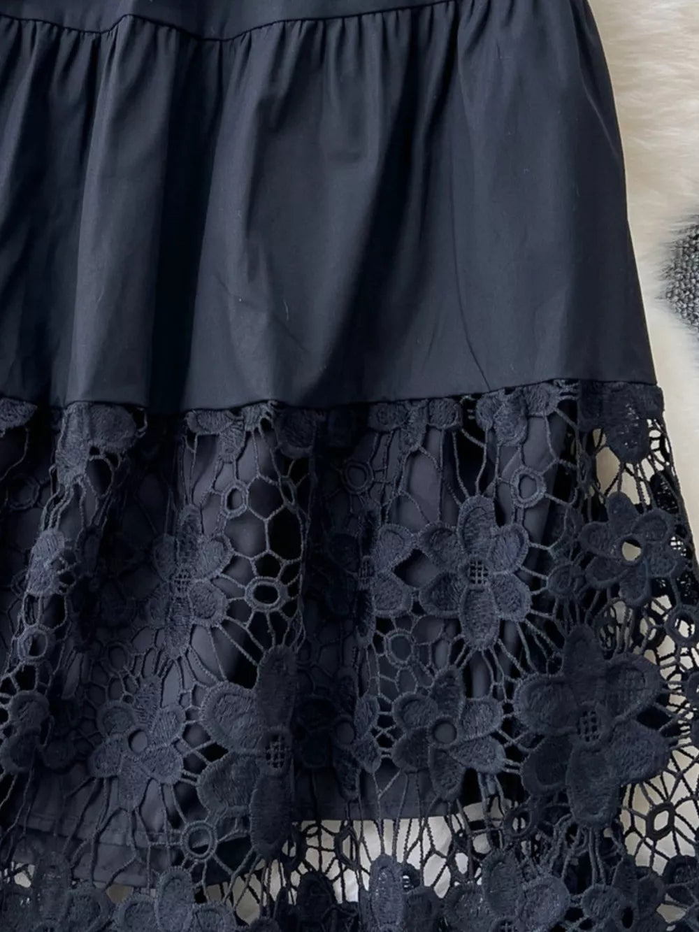 Black tiered skirt with elastic waist and floral lace hem detail