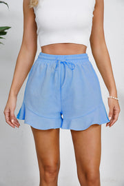 Blue linen blend shorts with drawstring waist and flounce hem