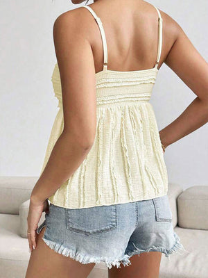 Light yellow textured sweetheart neck cami top with smocked bodice and tiered ruffle detail.