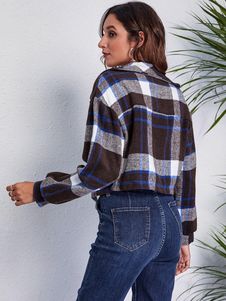 Chic plaid jacket in dark blue, white, and brown with button details.