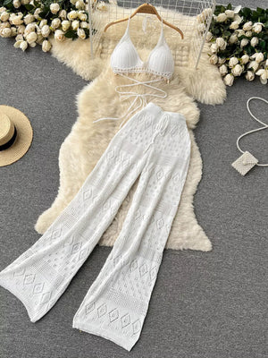 White crochet halter bikini top and wide-leg pants set with diamond pattern.