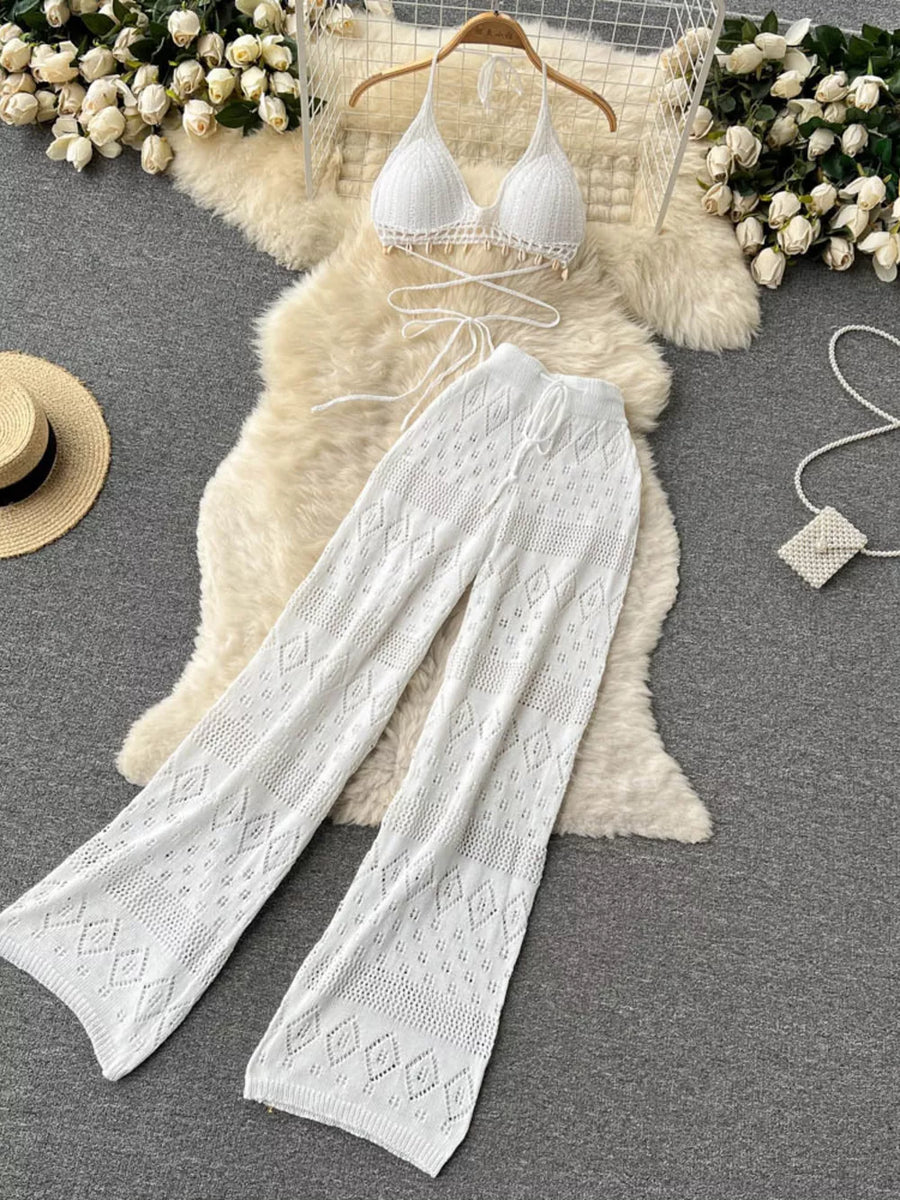 White crochet halter bikini top and wide-leg pants set with diamond pattern.