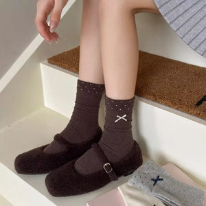 Chocolate socks featuring ribbed cuff and polka dot