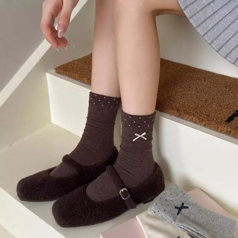 Chocolate socks featuring ribbed cuff and polka dot