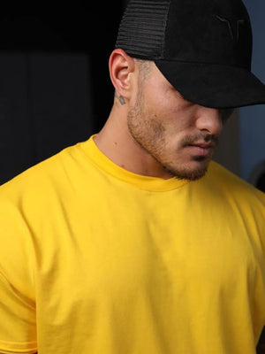 Oversized textured crew neck tee in gold with a crew neckline.